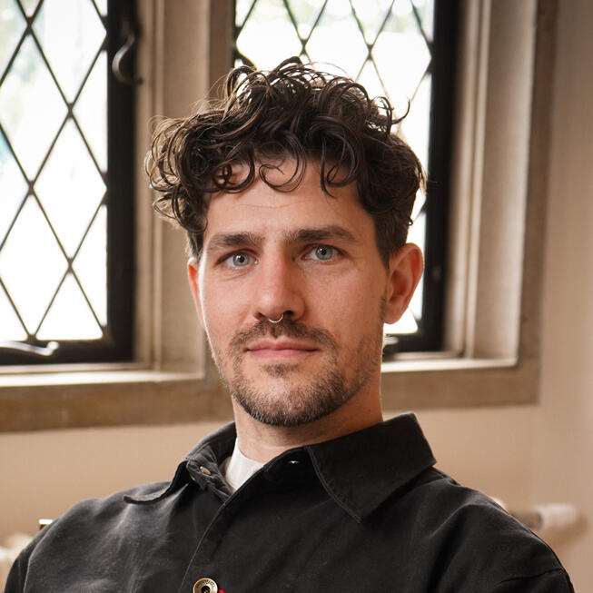Headshot photo of Kyle Sullivan, therapist and educator, in his Rochester office.